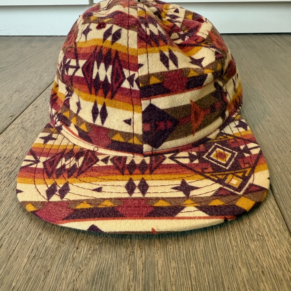 Vibrant Flannel Red and Orange Cap with Geometric Patterns